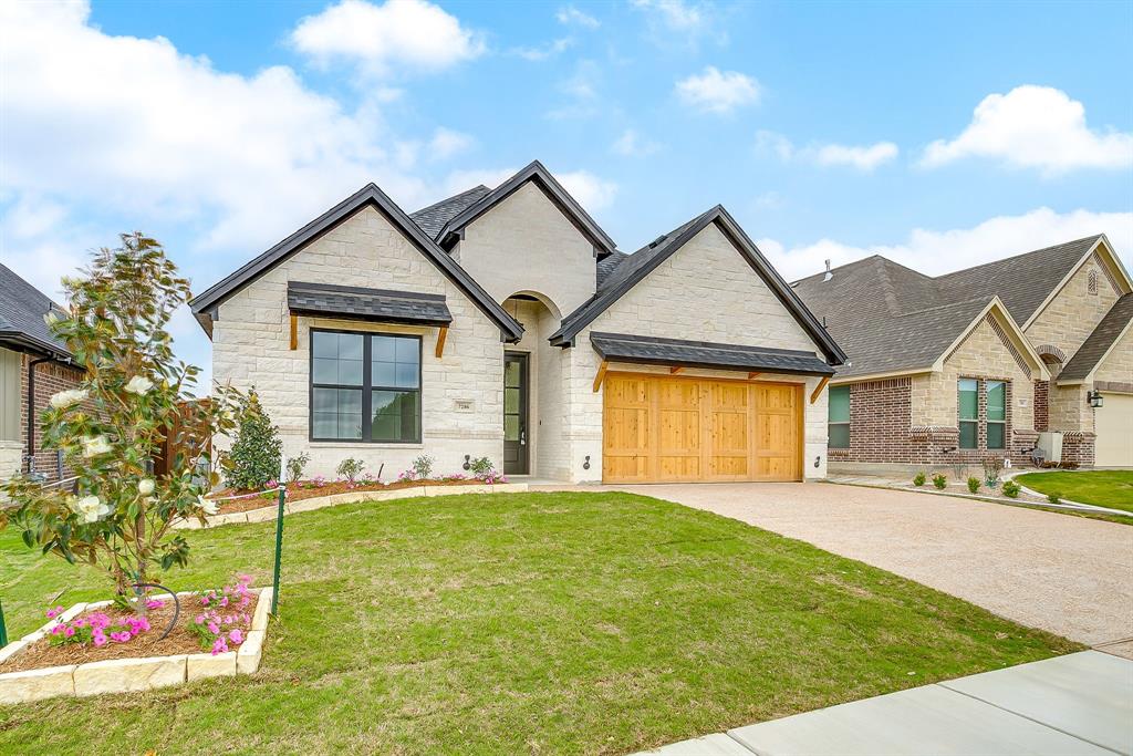 7286 Velvetleaf Street Benbrook, TX 76126 - Photo 3 of 39 a front view of a house with a yard and garage