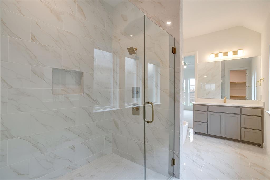 7286 Velvetleaf Street Benbrook, TX 76126 - Photo 32 of 39 a bathroom with a granite countertop shower a sink and a mirror