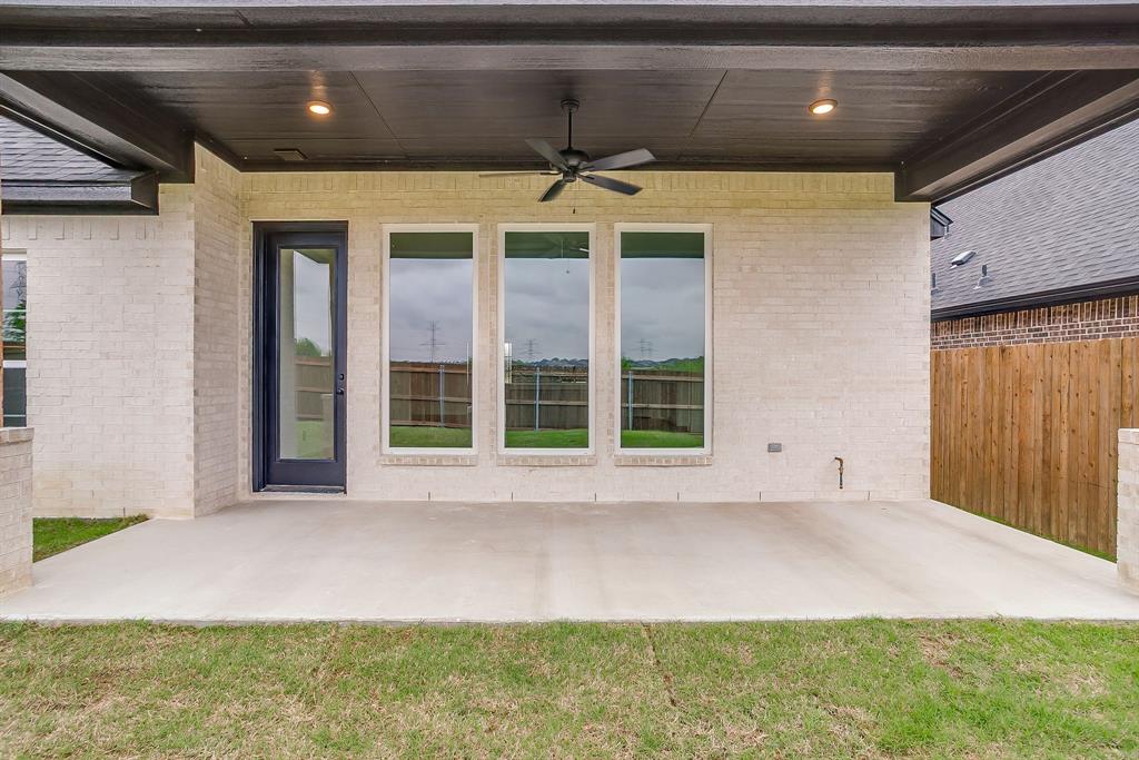 7286 Velvetleaf Street Benbrook, TX 76126 - Photo 35 of 39 a front view of a house with a yard