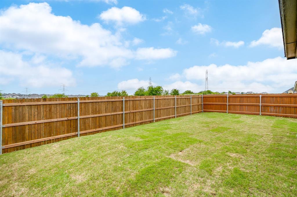 7286 Velvetleaf Street Benbrook, TX 76126 - Photo 36 of 39 a view of a yard with wooden fence
