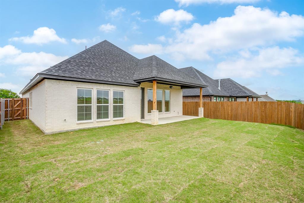 7286 Velvetleaf Street Benbrook, TX 76126 - Photo 38 of 39 a view of a house with a garden and yard