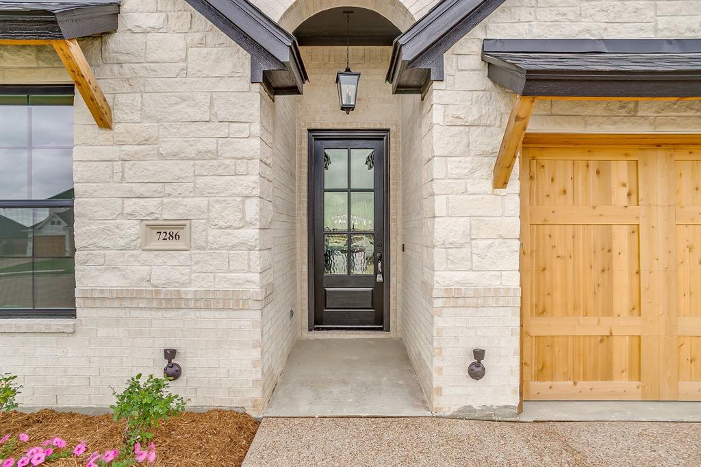 7286 Velvetleaf Street Benbrook, TX 76126 - Photo 4 of 39 a front view of a house with a glass door