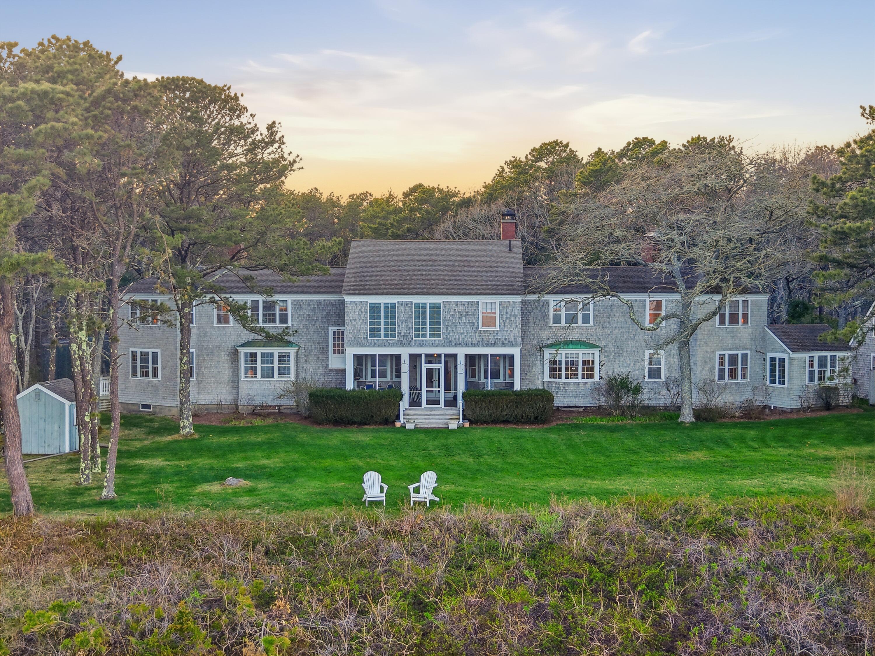 190 Vineyard Road Cotuit, MA 02635 - Photo 7 of 41 a view of a house with a yard and sitting area