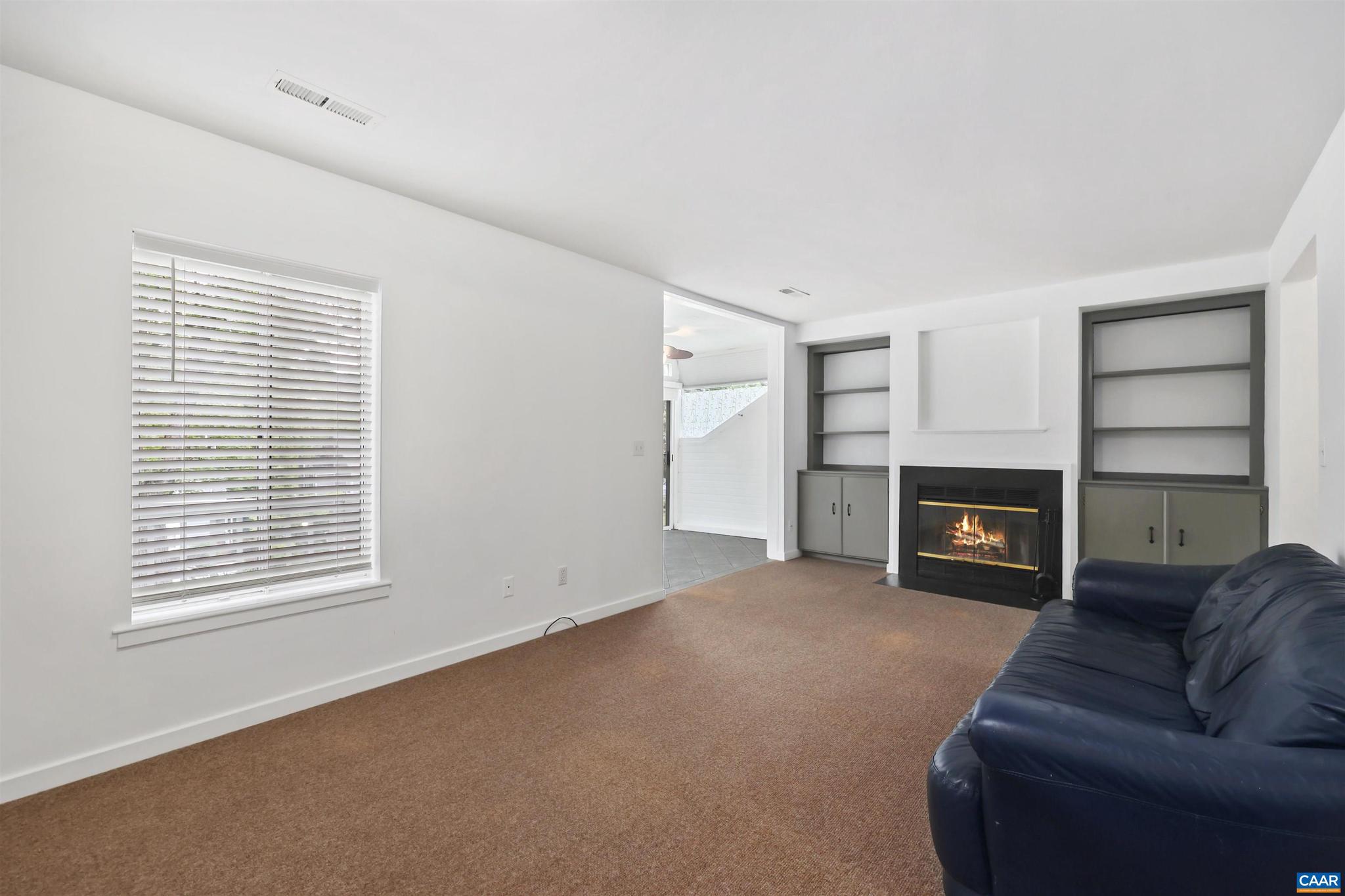 1250 Maple View Drive Charlottesville, VA 22902 - Photo 10 of 25 a view of a livingroom with a fireplace and window