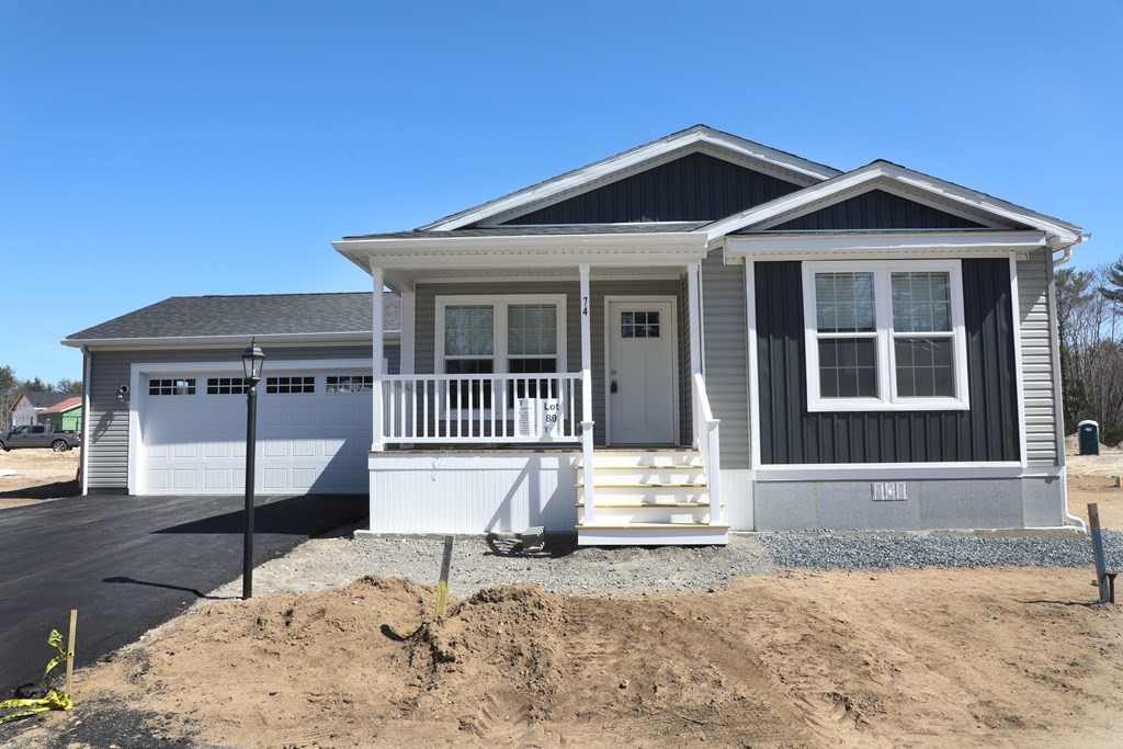 Lot 89 Sycamore Lane East Taunton, MA 02718 - Photo 1 of 24 a front view of a house with a yard