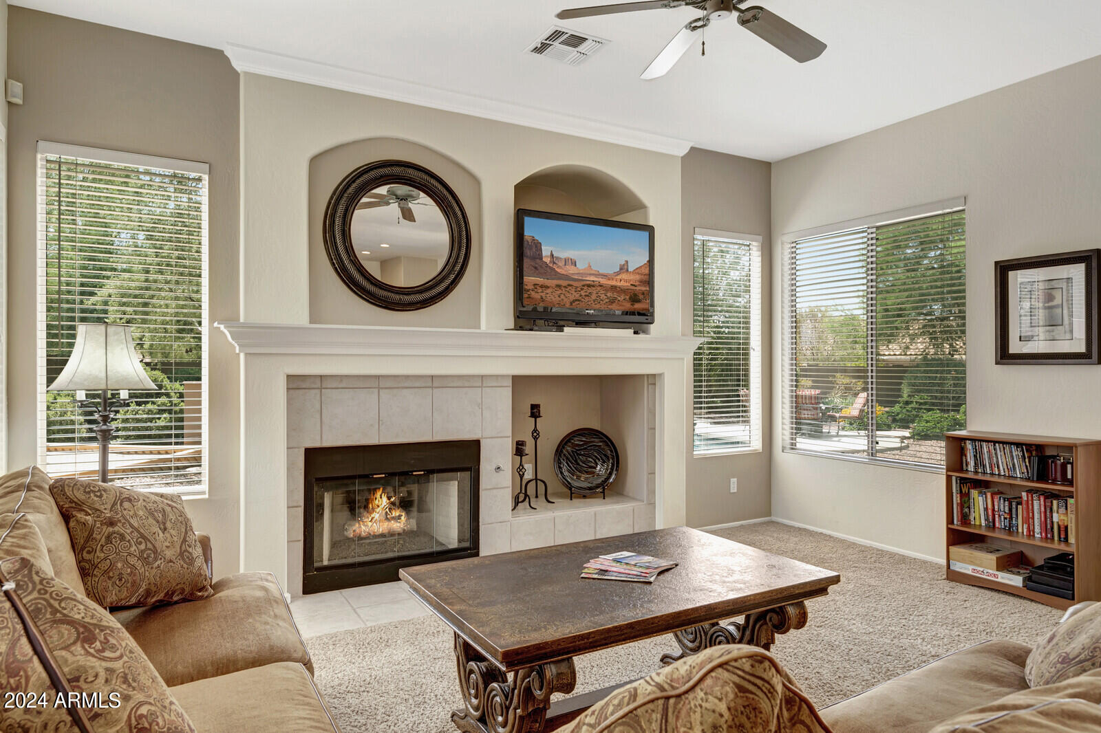 4343 East Mossman Drive Phoenix, AZ 85050 - Photo 13 of 36 a living room with furniture and a fireplace