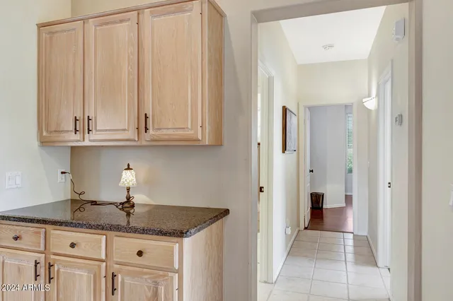 a bedroom with a dresser and a dresser