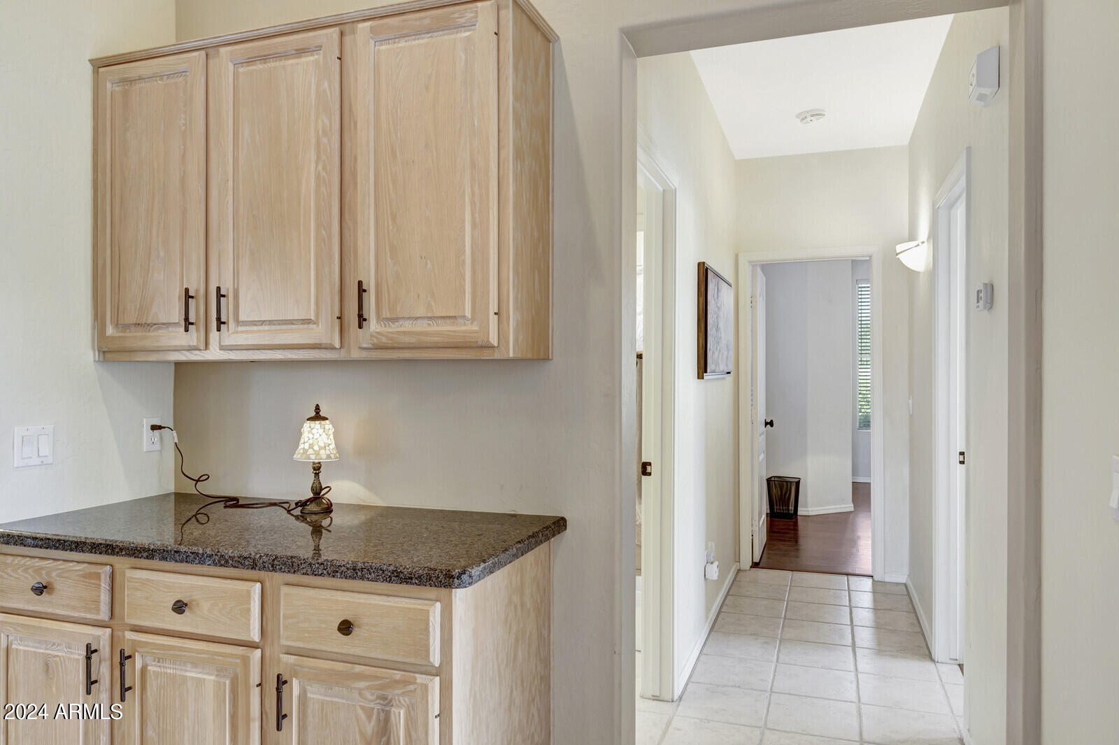 4343 East Mossman Drive Phoenix, AZ 85050 - Photo 16 of 36 a kitchen with granite countertop a sink and cabinets