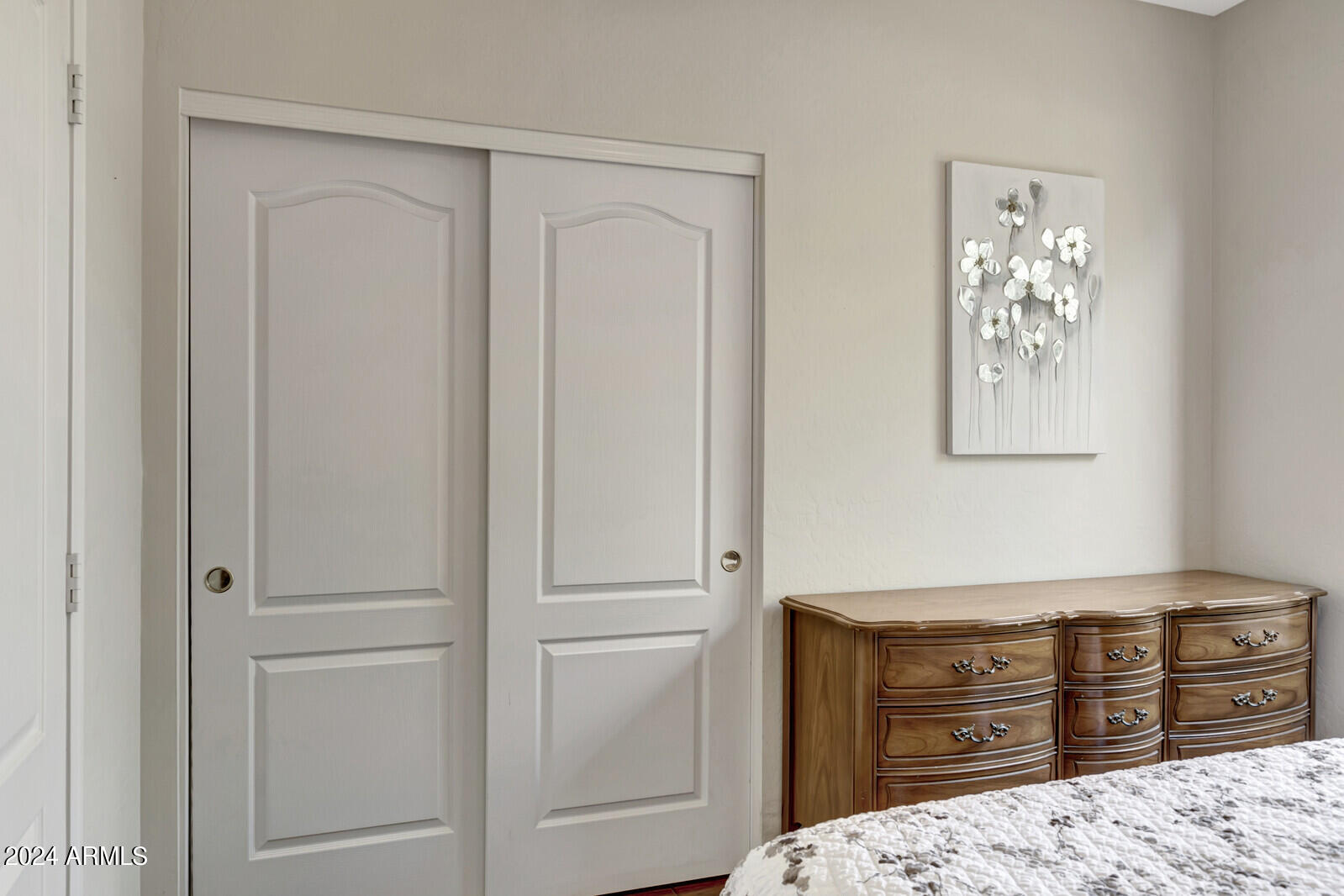 4343 East Mossman Drive Phoenix, AZ 85050 - Photo 19 of 36 a bedroom with a dresser and a dresser