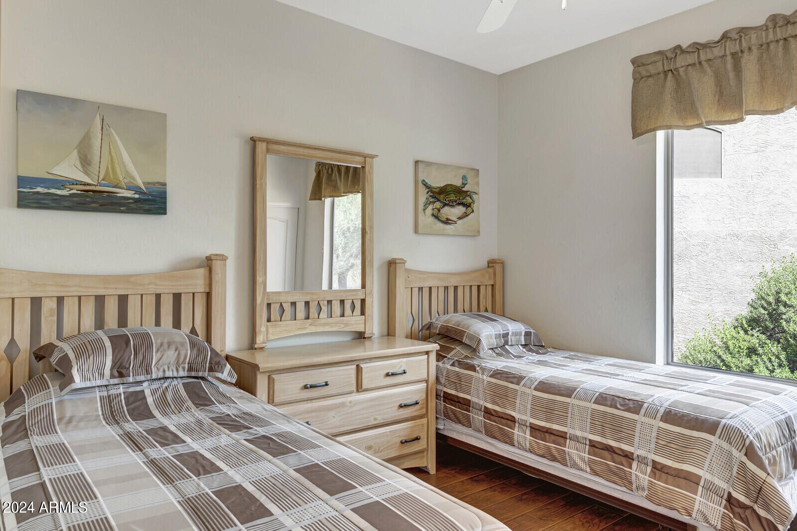 4343 East Mossman Drive Phoenix, AZ 85050 - Photo 20 of 36 a bedroom with a bed next to a window with outer view