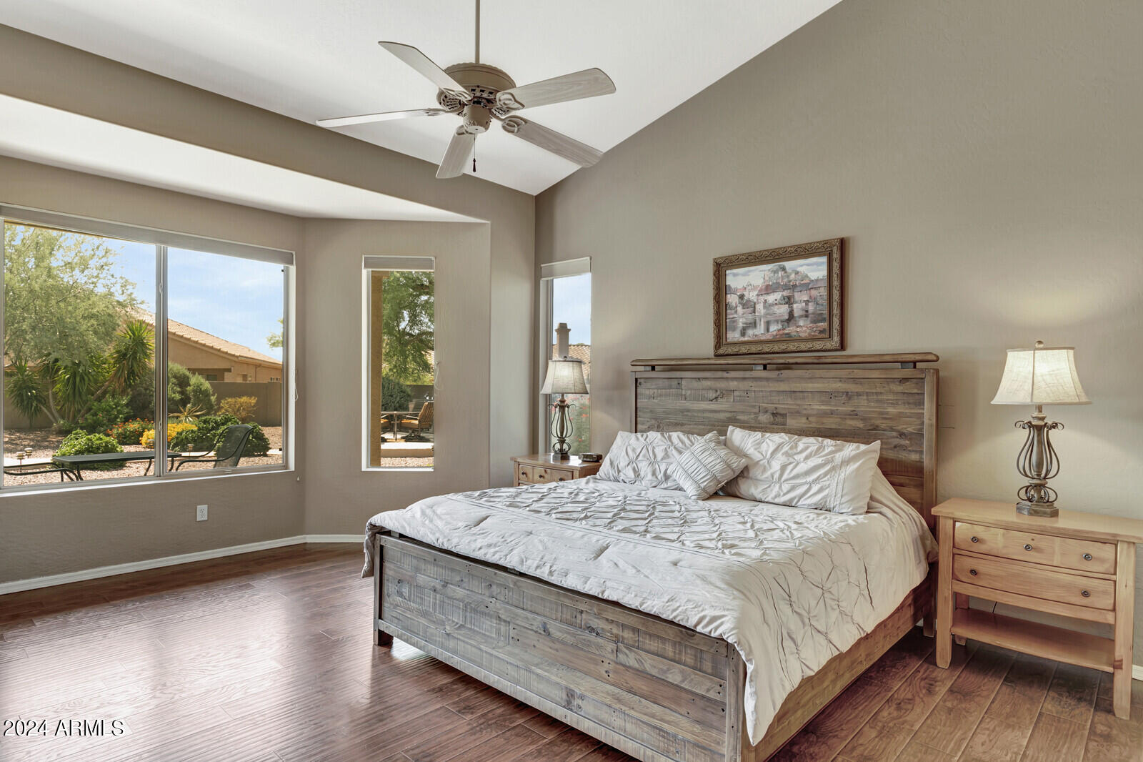 4343 East Mossman Drive Phoenix, AZ 85050 - Photo 23 of 36 a bedroom with a large bed and a large window