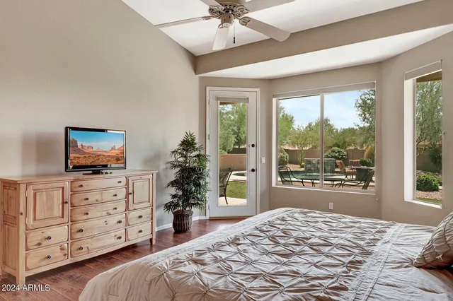 a view of a house with swimming pool and sitting area