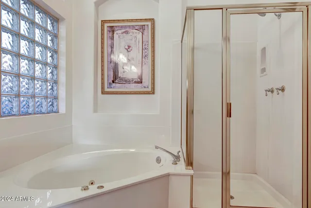 a view of a chairs and table in backyard