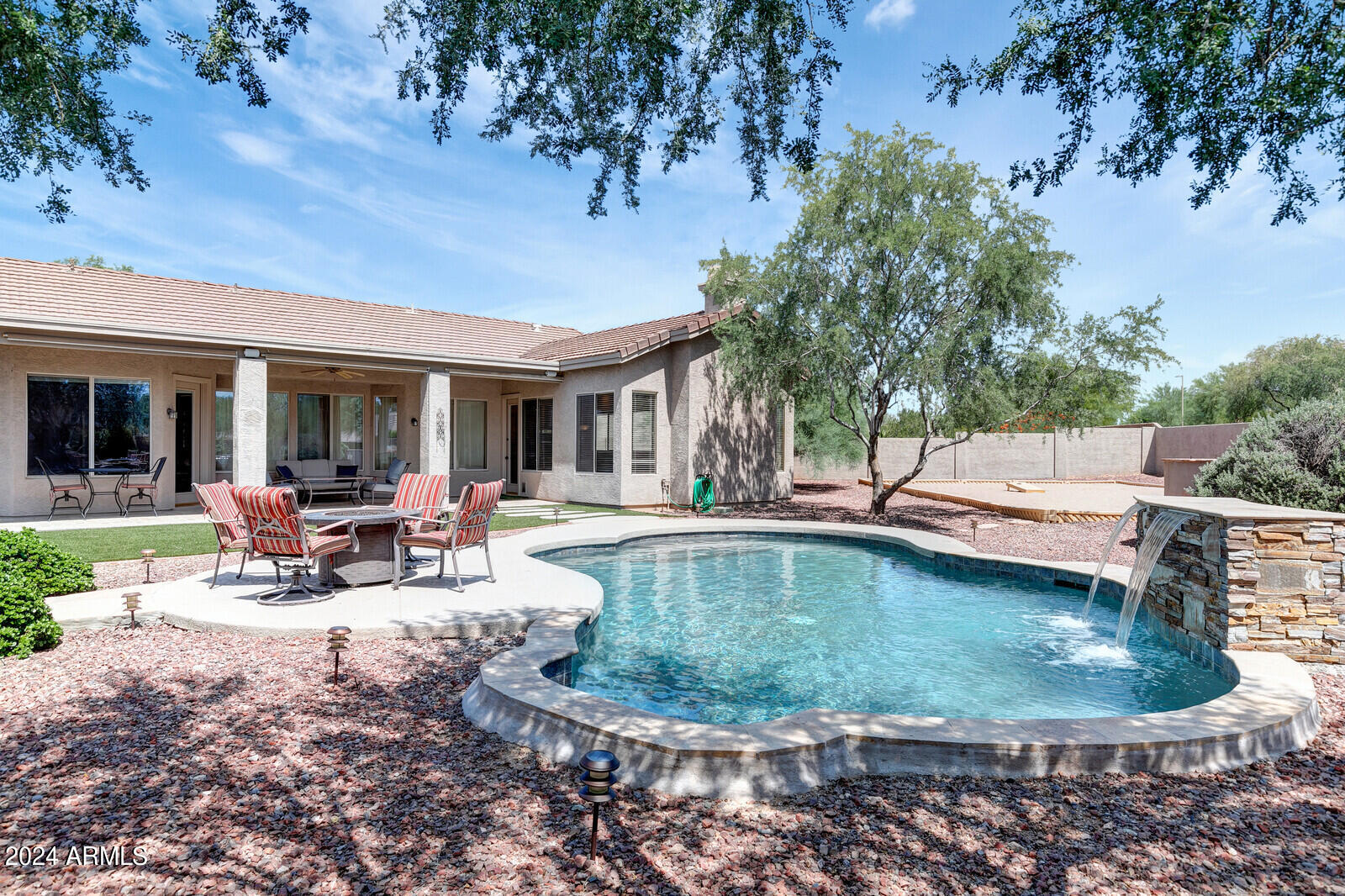 4343 East Mossman Drive Phoenix, AZ 85050 - Photo 30 of 36 a view of a house with swimming pool and sitting area