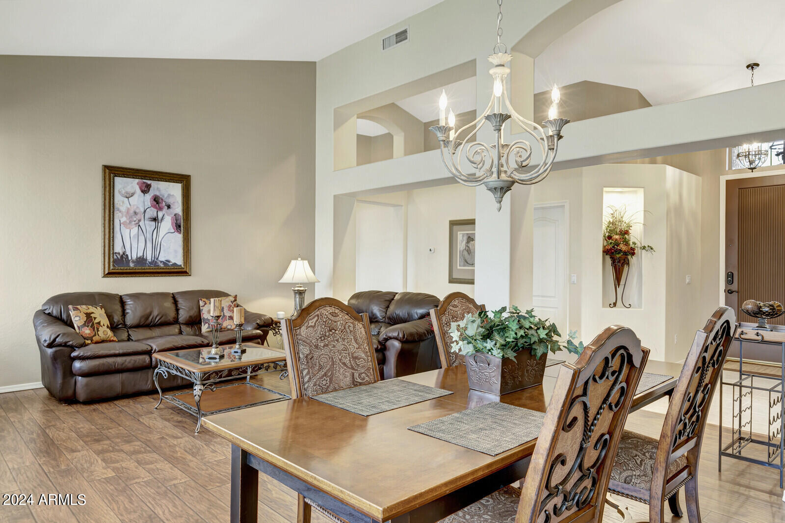 4343 East Mossman Drive Phoenix, AZ 85050 - Photo 5 of 36 a living room with furniture a chandelier and a chandelier