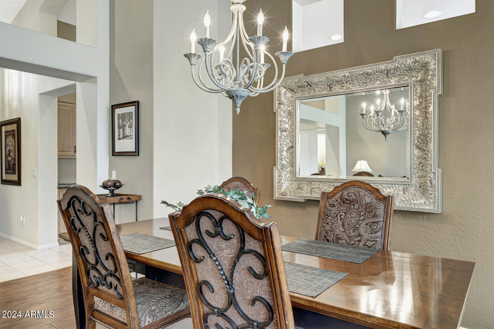 4343 East Mossman Drive Phoenix, AZ 85050 - Photo 6 of 36 a view of a dining room and chandelier