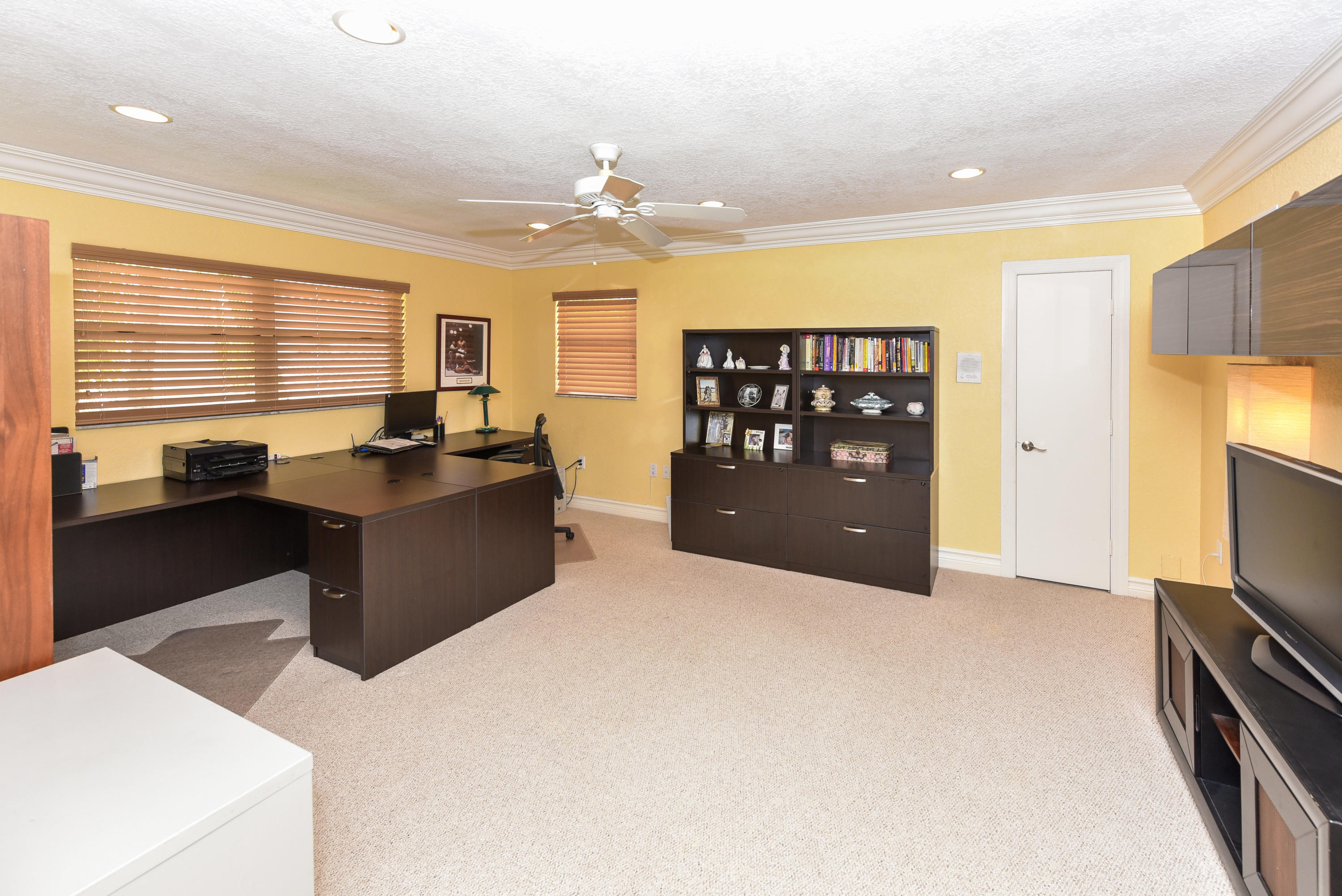 5855 Paddington Way Boca Raton, FL 33496 - Photo 19 of 40 a kitchen with stainless steel appliances kitchen island granite countertop a refrigerator a sink dishwasher a dining table and chairs with wooden floor