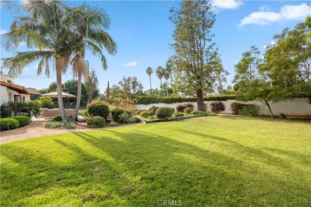 a front view of a house with swimming pool having outdoor seating
