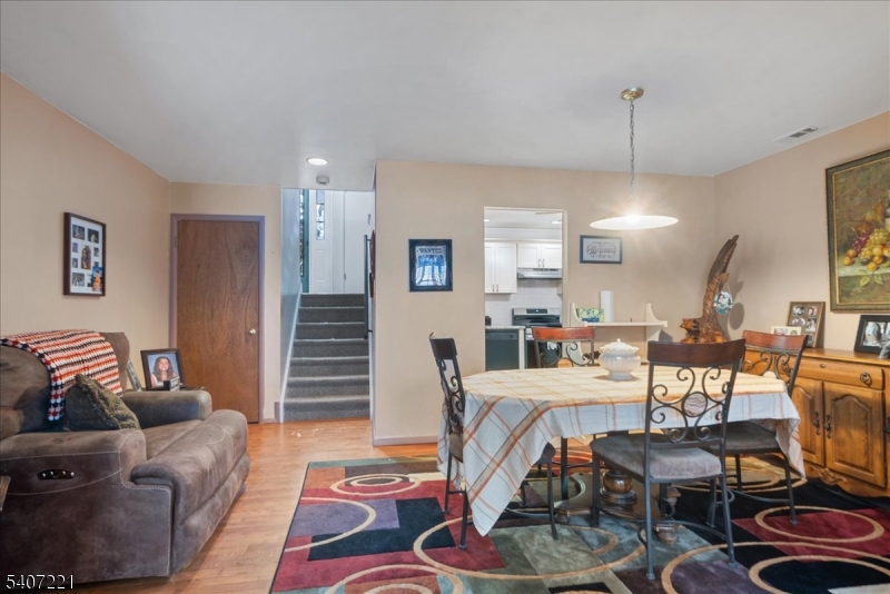 33 Concord Road, Unit D West Milford, NJ 07480 - Photo 14 of 39 a living room with furniture and a wooden floor