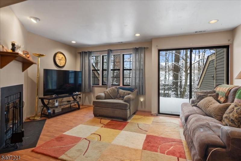 33 Concord Road, Unit D West Milford, NJ 07480 - Photo 15 of 39 a living room with furniture a large window and a flat screen tv