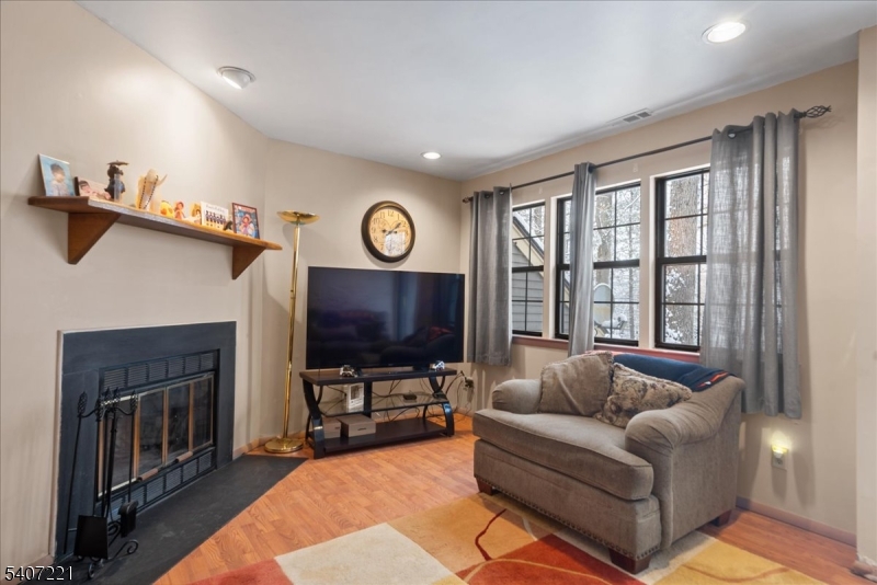 33 Concord Road, Unit D West Milford, NJ 07480 - Photo 18 of 39 a living room with furniture and a flat screen tv