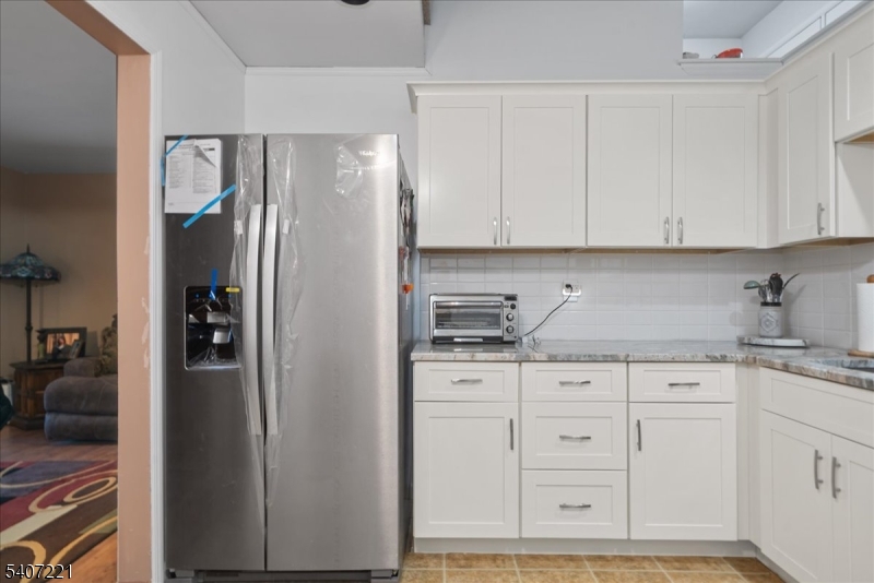 33 Concord Road, Unit D West Milford, NJ 07480 - Photo 25 of 39 a kitchen with stainless steel appliances granite countertop a refrigerator and cabinets