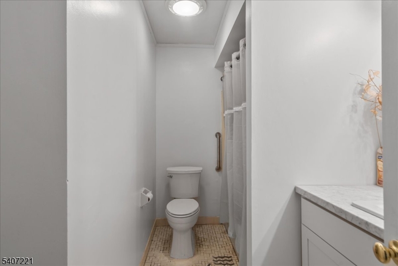 33 Concord Road, Unit D West Milford, NJ 07480 - Photo 28 of 39 a bathroom with a granite countertop toilet and a shower