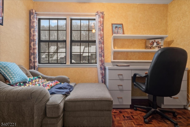 33 Concord Road, Unit D West Milford, NJ 07480 - Photo 34 of 39 a bed sitting in a bedroom next to a window