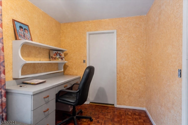 33 Concord Road, Unit D West Milford, NJ 07480 - Photo 35 of 39 a view of a workspace with furniture and wooden floor