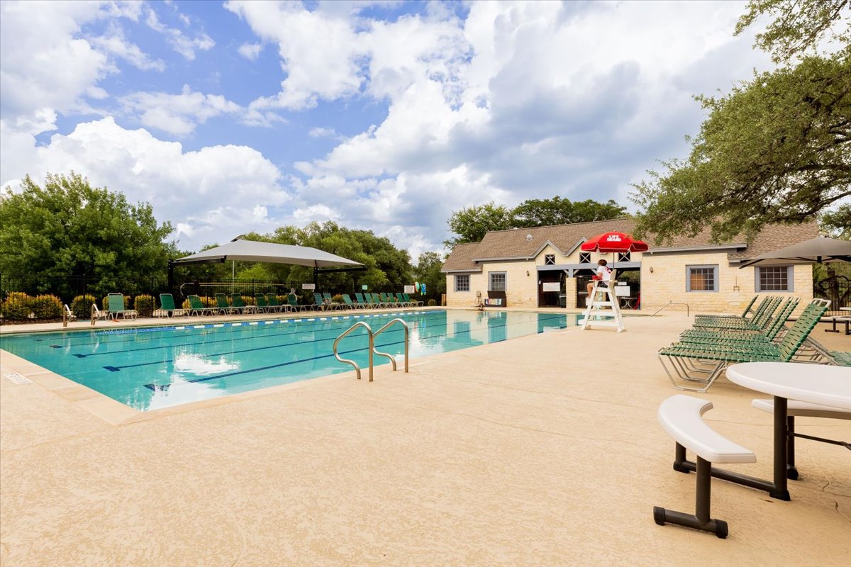 7136 Ridge Oak Road Austin, TX 78749 - Photo 23 of 28 An inviting community pool awaits, offering refreshing recreation under an open sky.