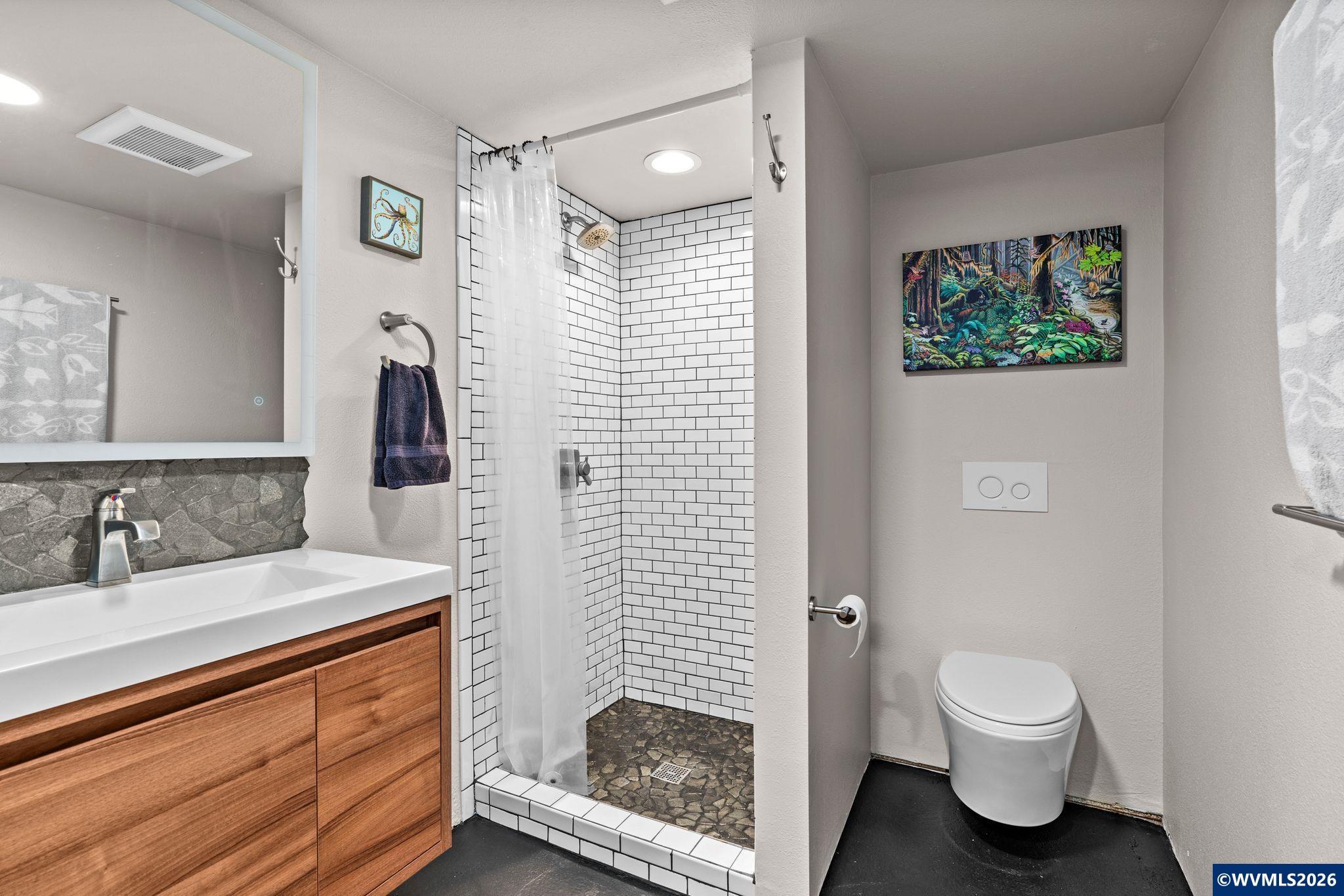 444 Northwest 35th Street Corvallis, OR 97330 - Photo 21 of 40 a bathroom with a sink a toilet and shower