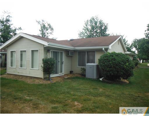 804 Pompton Road Monroe Township, NJ 08831 - Photo 3 of 12 a view of a house with a yard and a garden