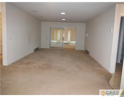 804 Pompton Road Monroe Township, NJ 08831 - Photo 5 of 12 a view of an empty room and a window