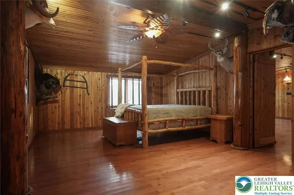 a view of a room with wooden walls