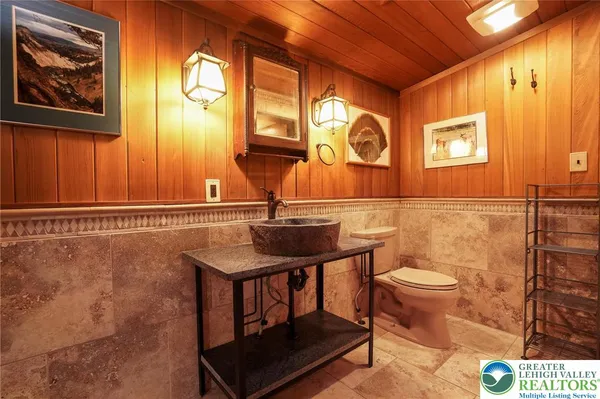 a bathroom with a toilet sink and shower