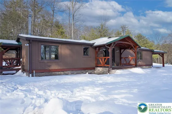 a view of a house with a yard and garage