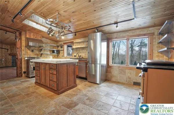 a kitchen with stainless steel appliances granite countertop a stove a sink and dishwasher
