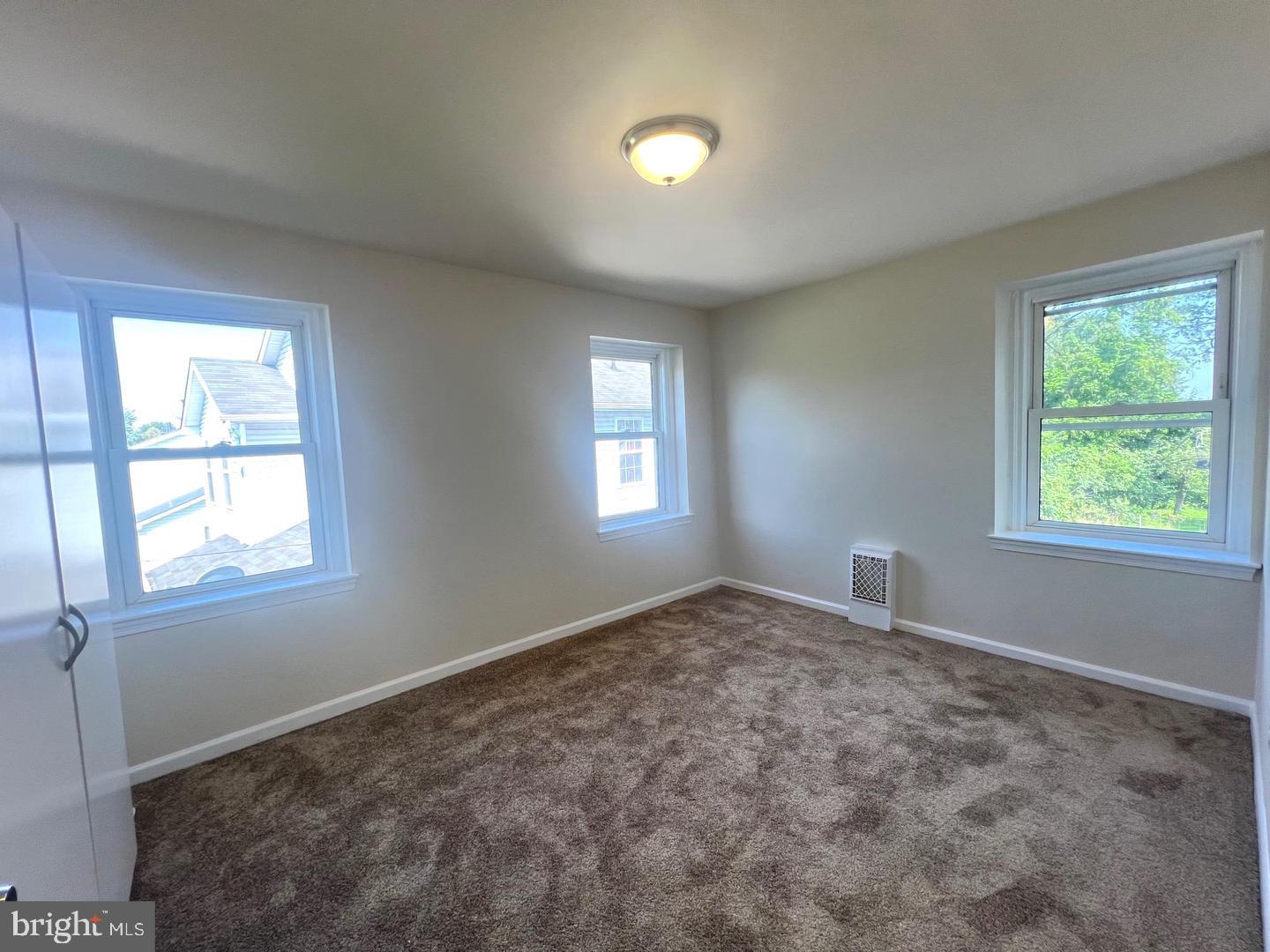 617 3rd Street Beverly, NJ 08010 - Photo 12 of 17 an empty room with windows