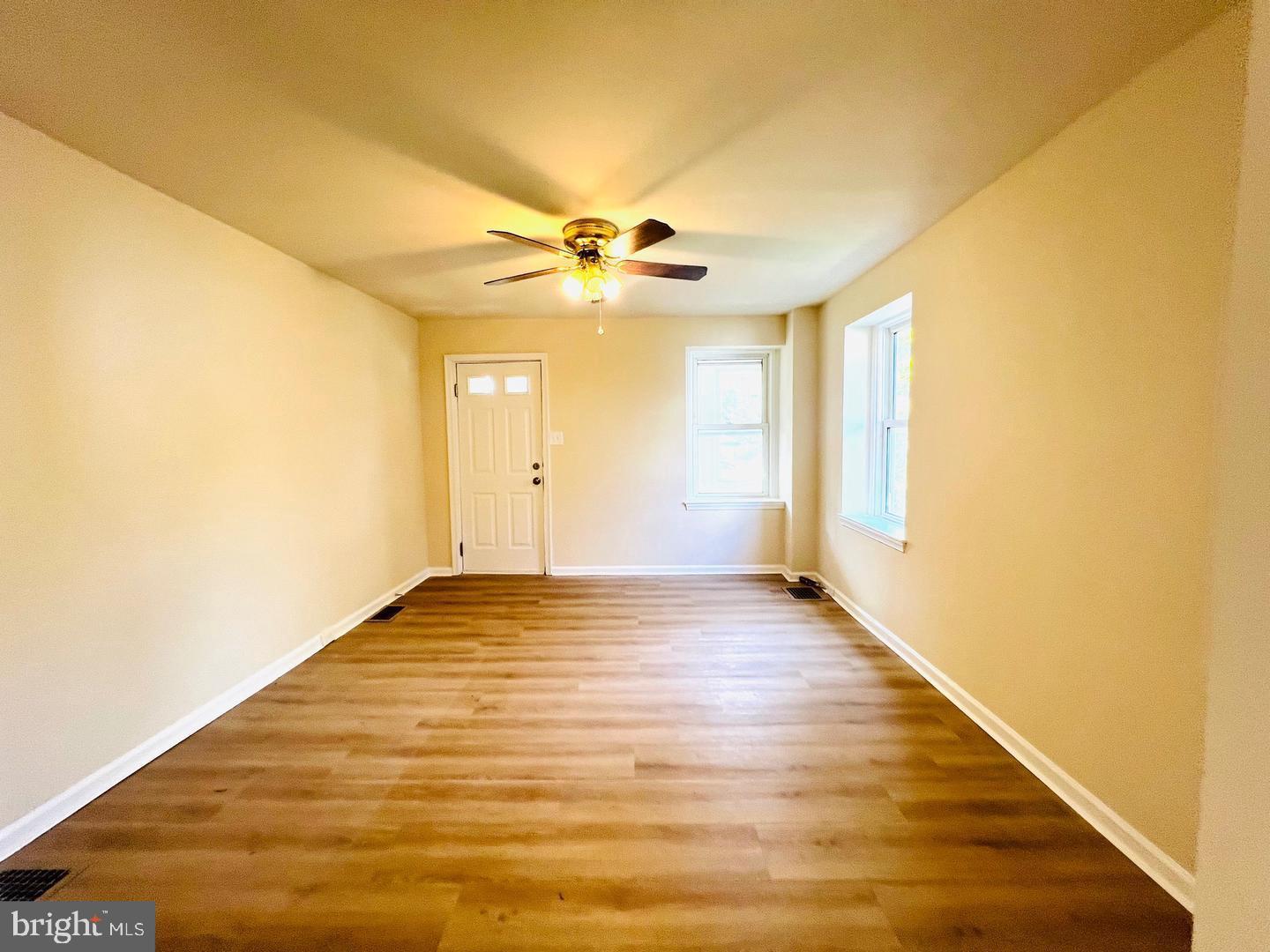 617 3rd Street Beverly, NJ 08010 - Photo 3 of 17 a view of an empty room with window and a ceiling fan
