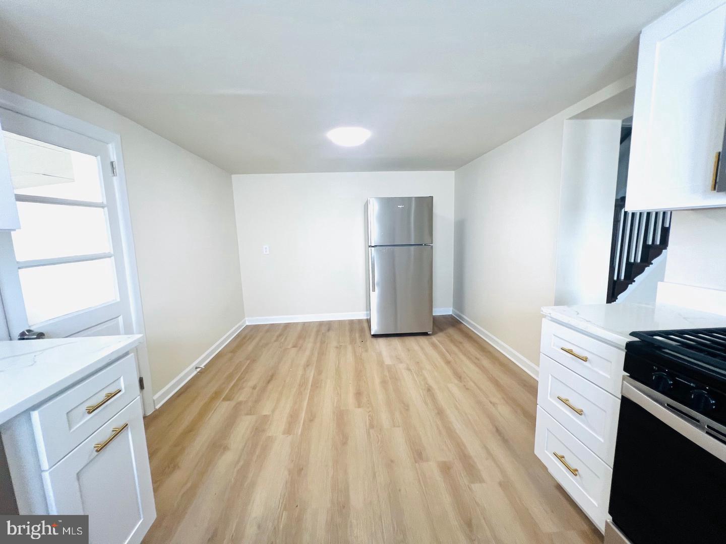 617 3rd Street Beverly, NJ 08010 - Photo 9 of 17 a view of kitchen and wooden floor