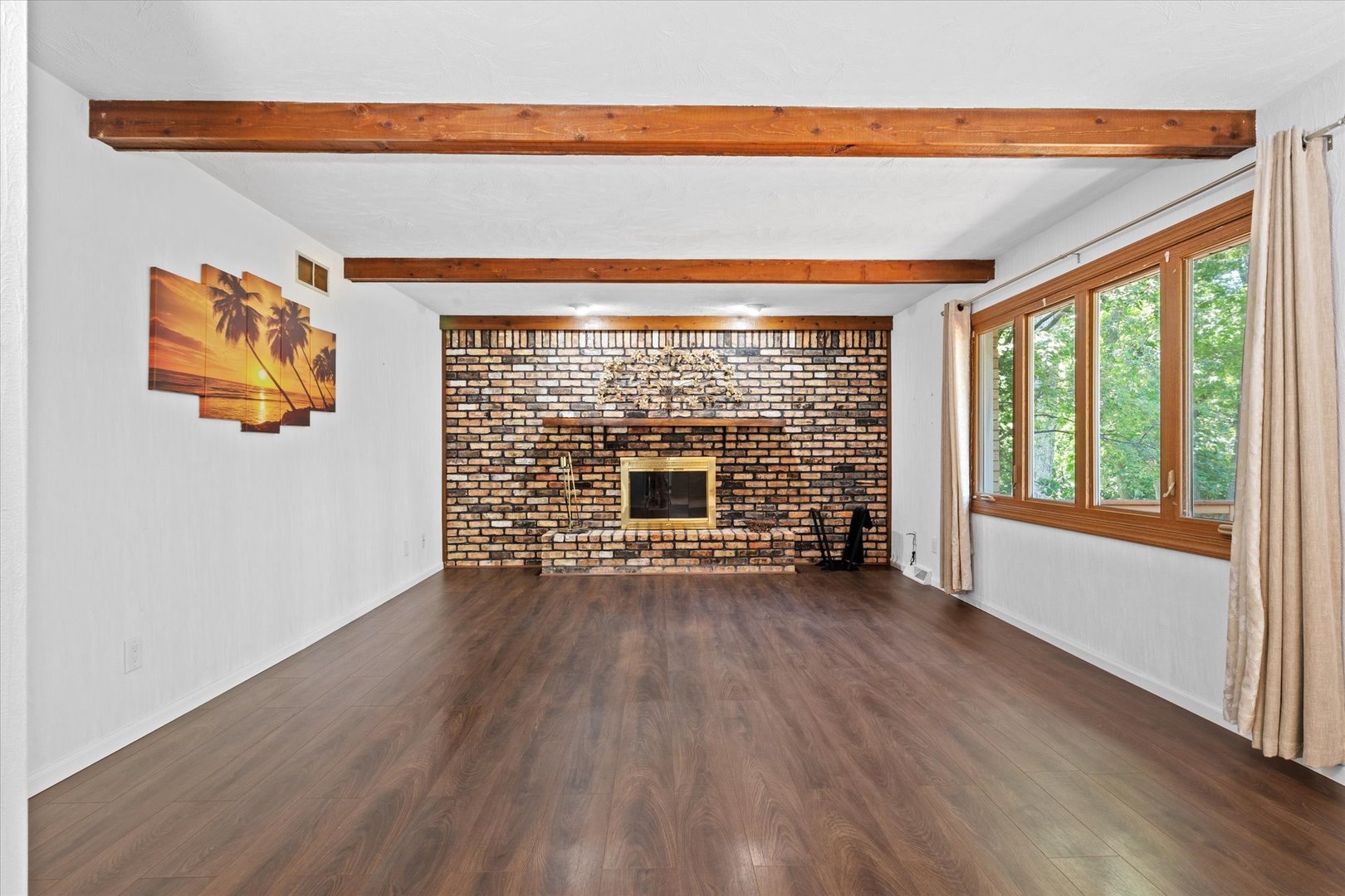 10 Oak Grove Road Geneseo, IL 61254 - Photo 6 of 43 a view of an empty room with wooden floor and a window
