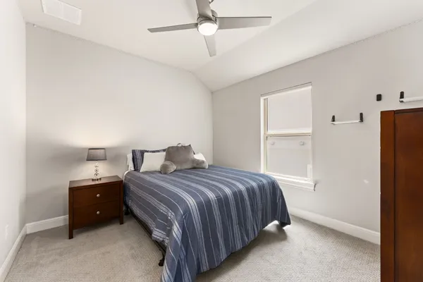 a bedroom with a bed and a closet