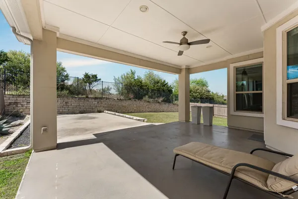 a view of a floor to ceiling window with backyard view