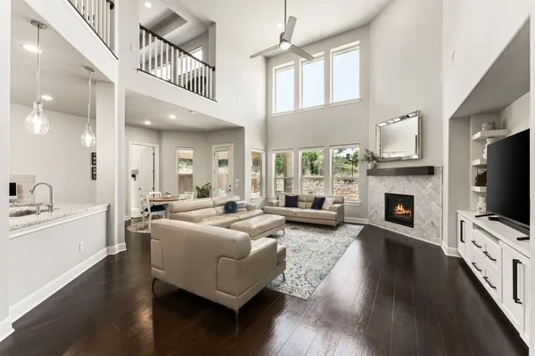 a living room with fireplace furniture and a flat screen tv