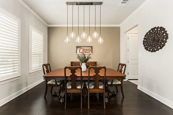 a view of a dining room with furniture and wooden floor