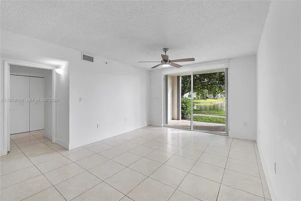 a kitchen with stainless steel appliances granite countertop a sink a stove and refrigerator