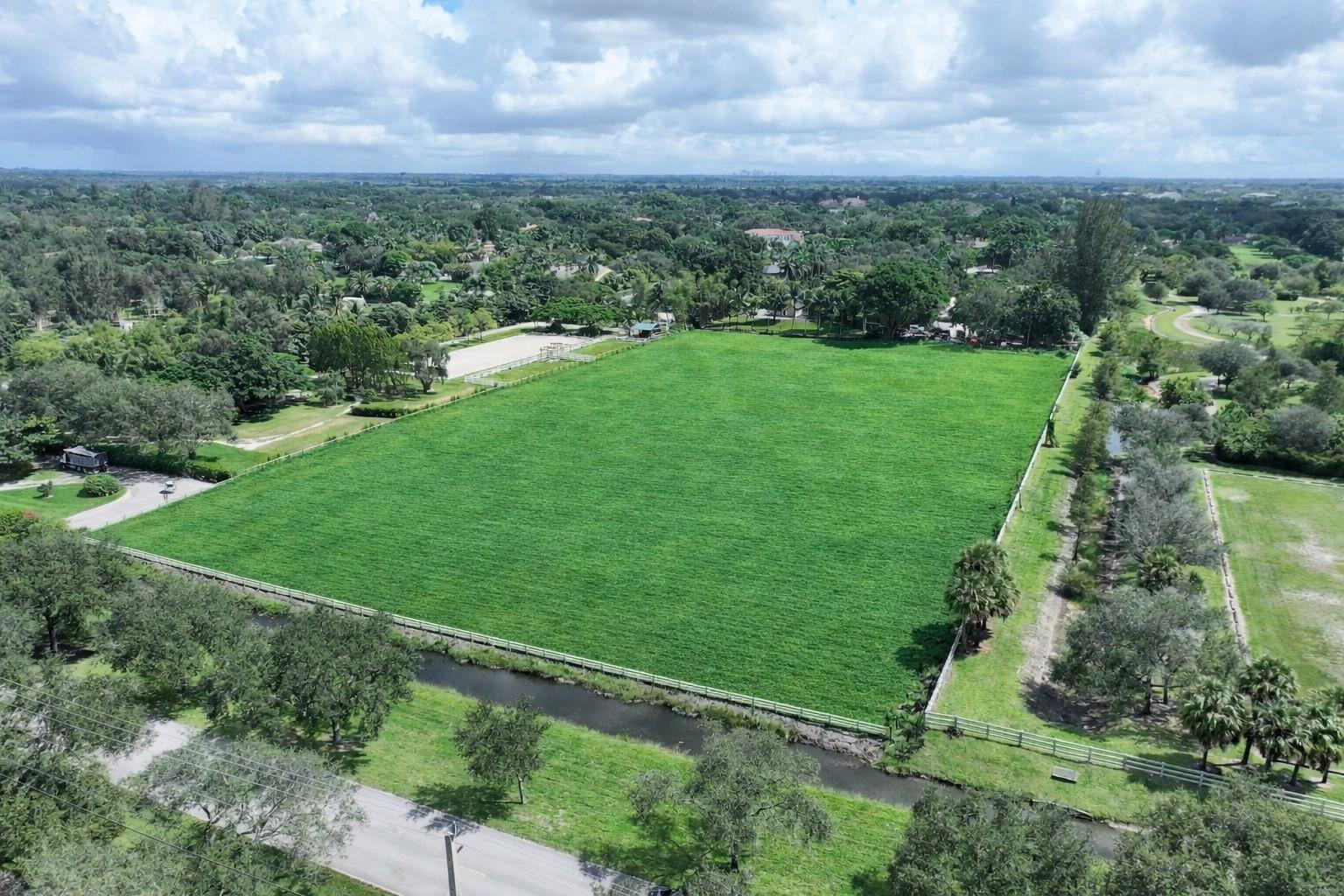 5750 Southwest 148th Avenue Southwest Ranches, FL 33330 - Photo 9 of 12 an aerial view of residential houses with outdoor space and trees