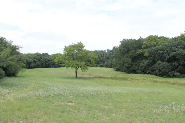 a view of a field with an outdoor space