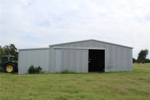 a view of a lake with houses in the back