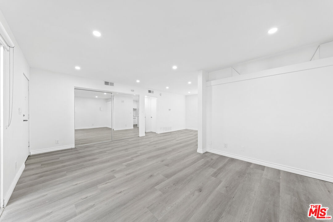 825 16th Street, Unit B Santa Monica, CA 90403 - Photo 11 of 15 a view of an empty room with wooden floor